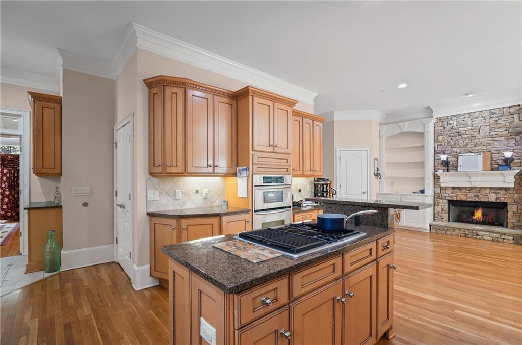 5053 Chapel Crossing Road Douglasville, GA 30135 - Photo 21 of 94 a kitchen with stainless steel appliances granite countertop a stove a sink and a refrigerator