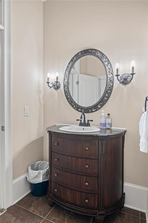 5053 Chapel Crossing Road Douglasville, GA 30135 - Photo 28 of 94 a bathroom with a toilet a sink and mirror