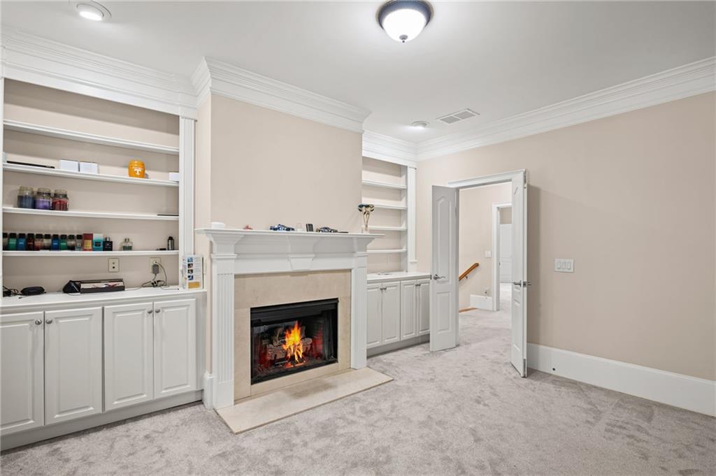 5053 Chapel Crossing Road Douglasville, GA 30135 - Photo 30 of 94 a living room with stainless steel appliances furniture a fireplace and a window