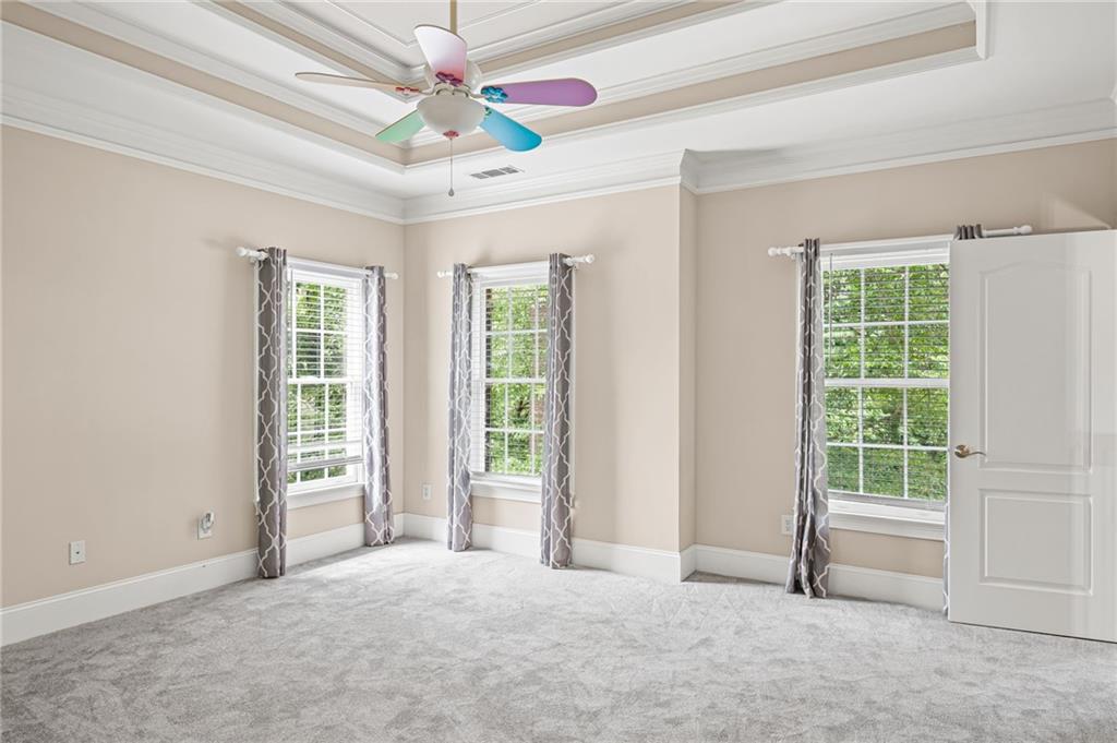 5053 Chapel Crossing Road Douglasville, GA 30135 - Photo 47 of 94 an empty room with windows and ceiling fan