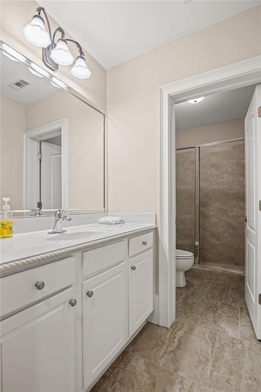 5053 Chapel Crossing Road Douglasville, GA 30135 - Photo 53 of 94 a bathroom with a double vanity sink and mirror