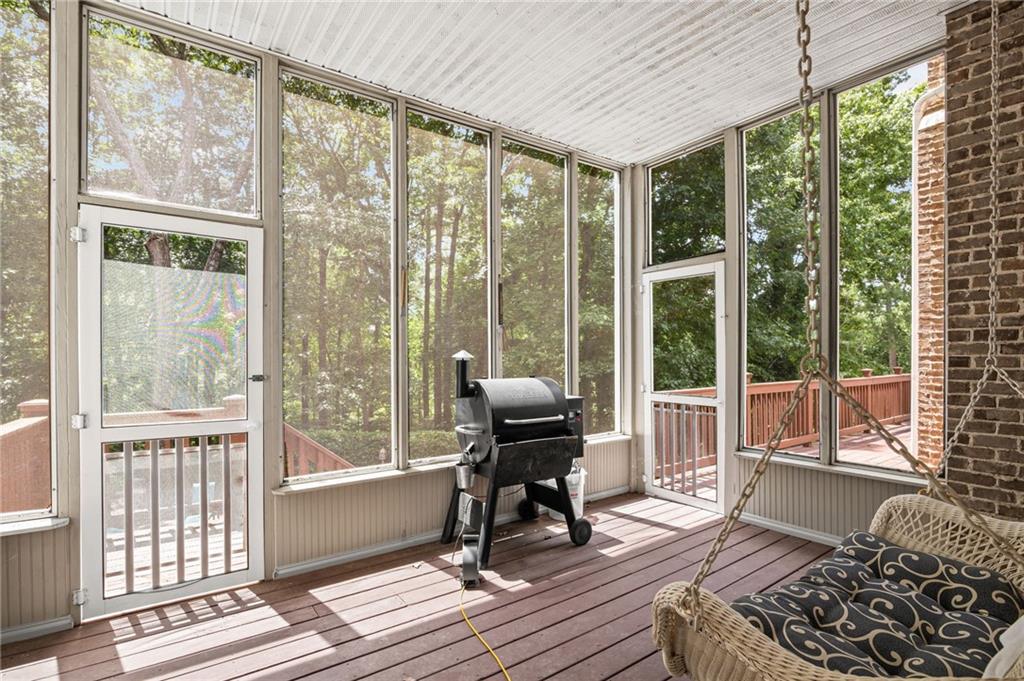 5053 Chapel Crossing Road Douglasville, GA 30135 - Photo 66 of 94 a living room with furniture and a floor to ceiling window