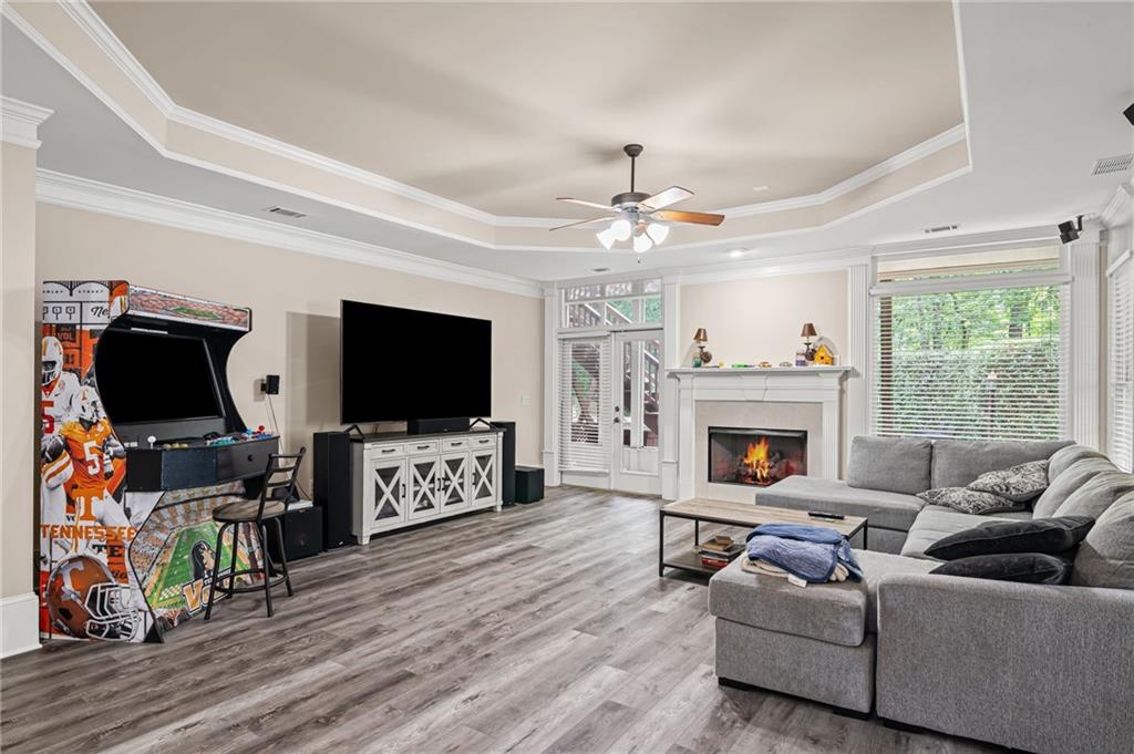 5053 Chapel Crossing Road Douglasville, GA 30135 - Photo 8 of 94 a living room with furniture a flat screen tv and a fireplace