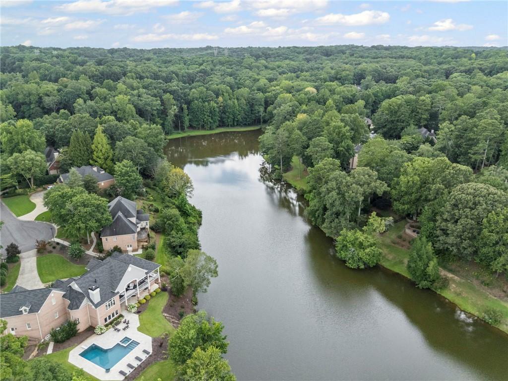 5053 Chapel Crossing Road Douglasville, GA 30135 - Photo 89 of 94 an aerial view of a house with a yard and lake view