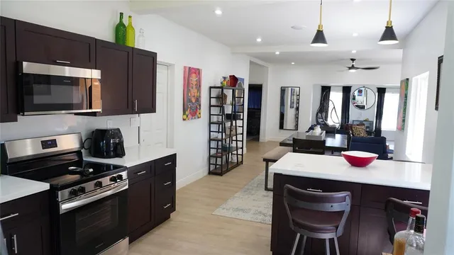 a kitchen with a stove cabinets and counter space