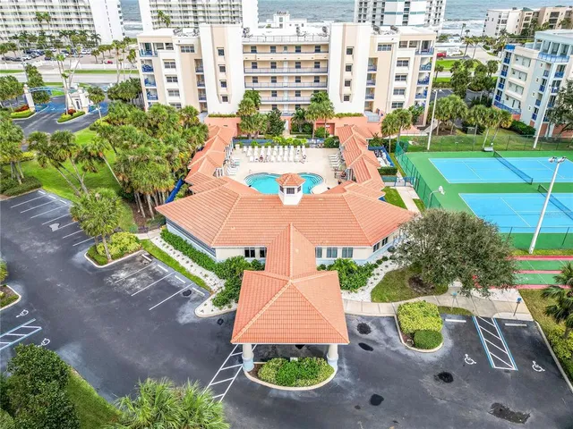 a view of an apartment with a swimming pool