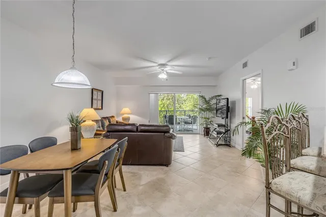 a view of a dining room and livingroom with furniture