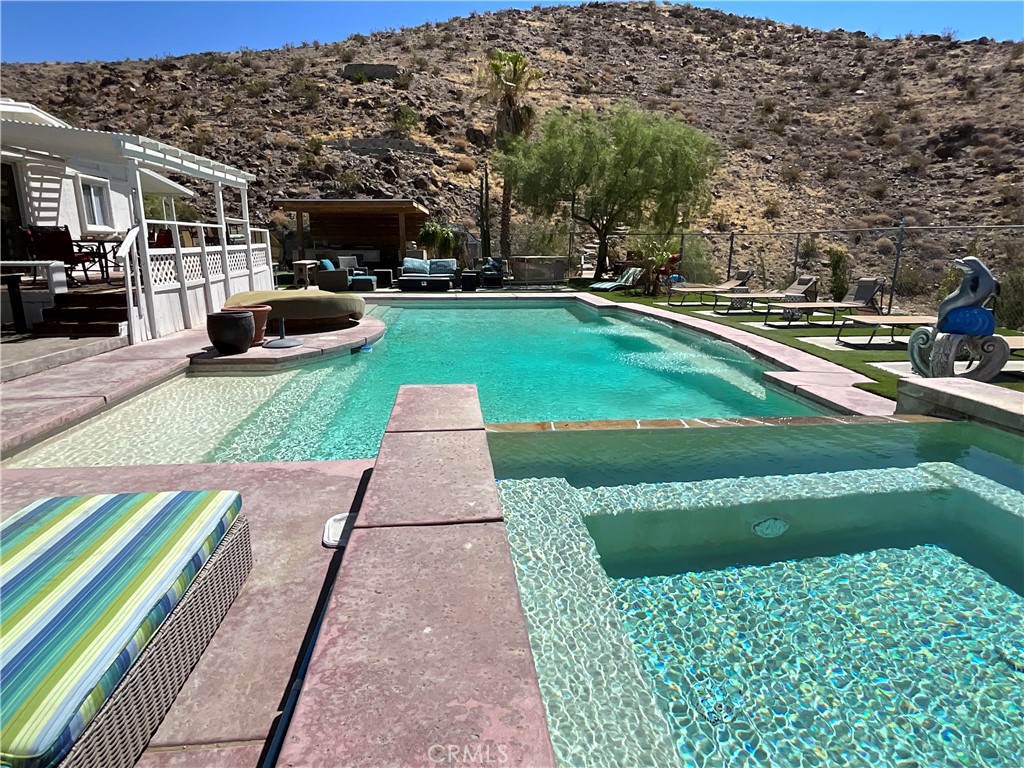 73405 Rask Road Desert Hot Springs, CA 92241 - Photo 11 of 26 a view of a street with houses