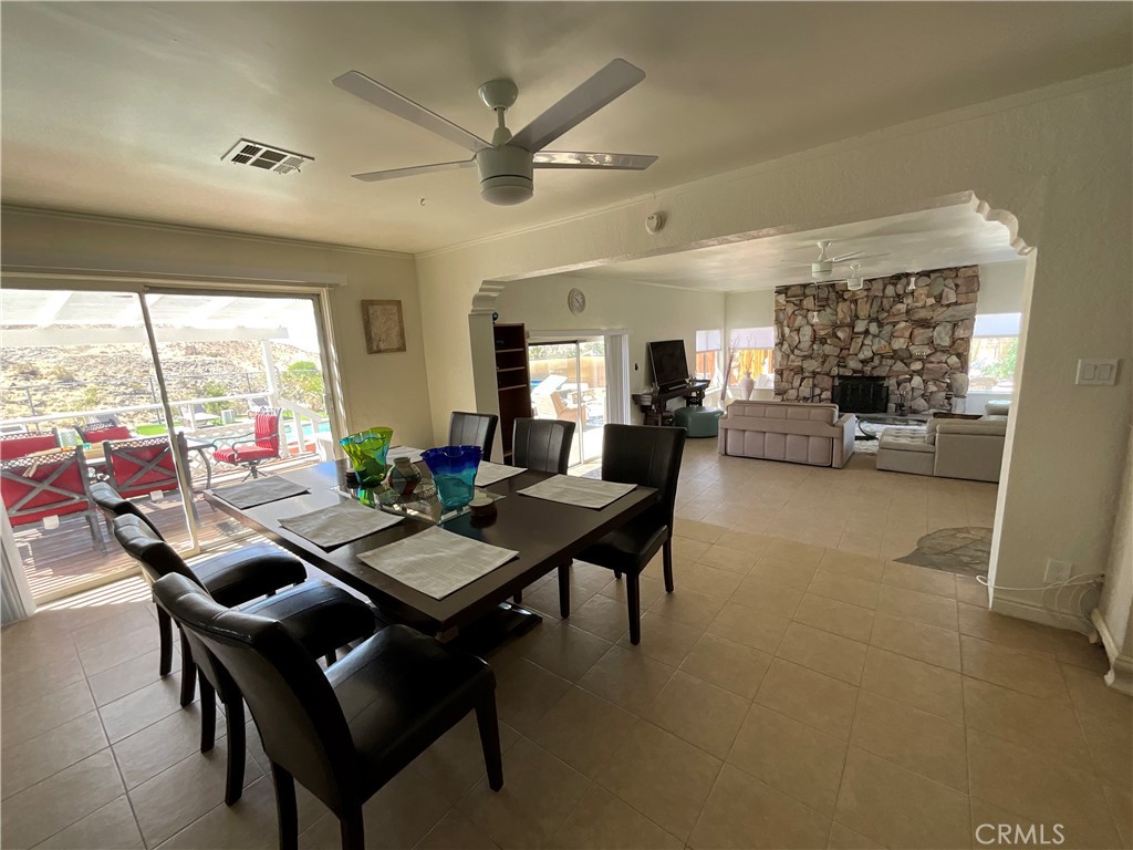 73405 Rask Road Desert Hot Springs, CA 92241 - Photo 14 of 26 a view of a dining room with furniture window and outside view