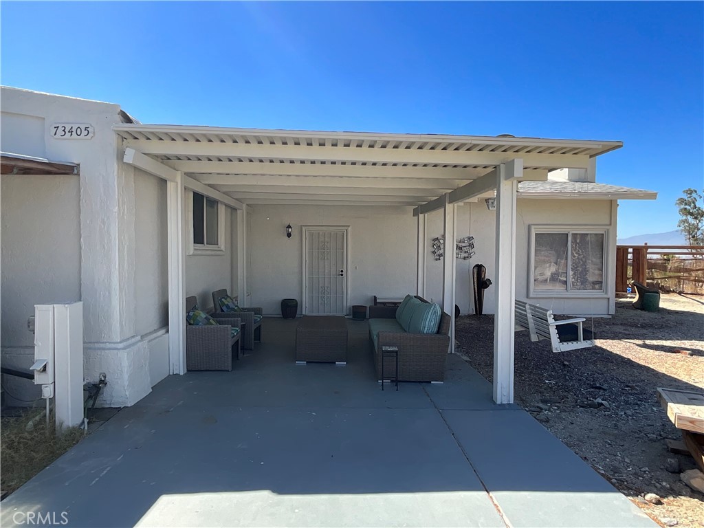 73405 Rask Road Desert Hot Springs, CA 92241 - Photo 24 of 26 a view of living room with furniture and a fireplace