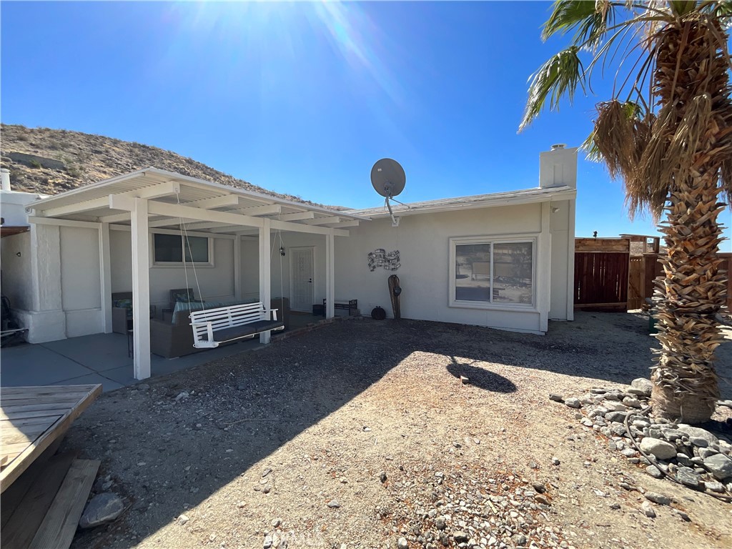 73405 Rask Road Desert Hot Springs, CA 92241 - Photo 25 of 26 a view of a house with a snow in the backyard
