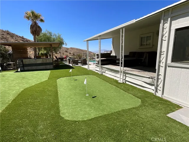 a view of a backyard with furniture