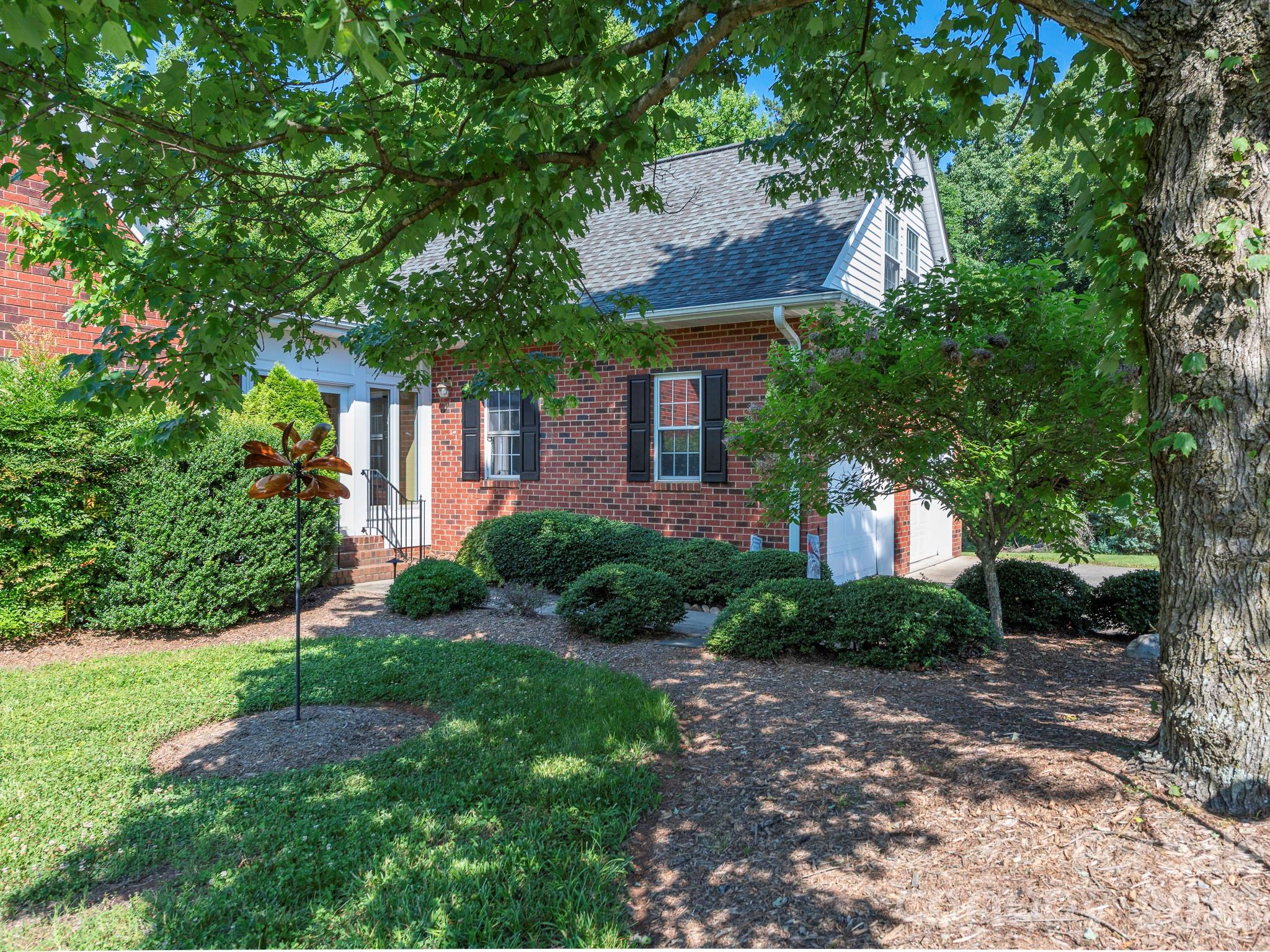 4440 Hucks Road Charlotte, NC 28269 - Photo 2 of 45 a front view of a house with garden