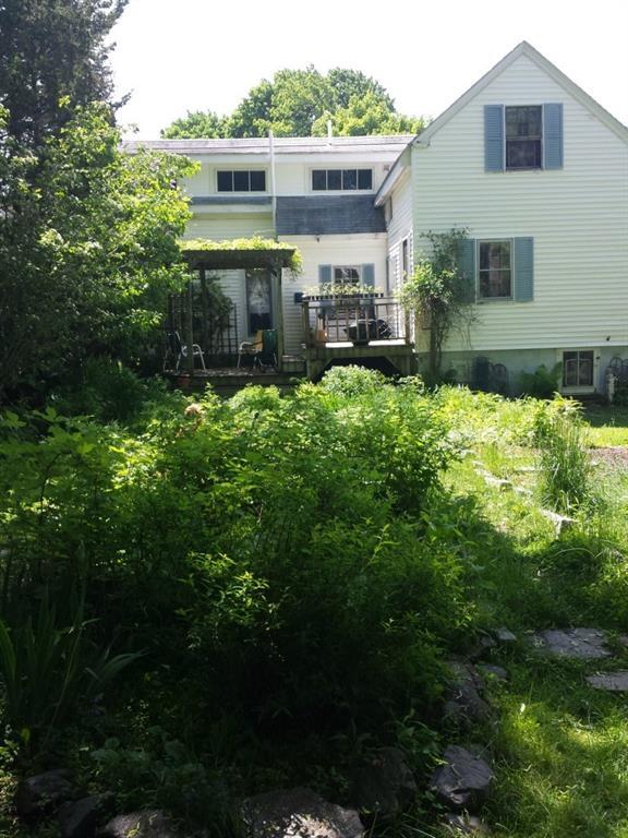 Lovely view of back of house with...