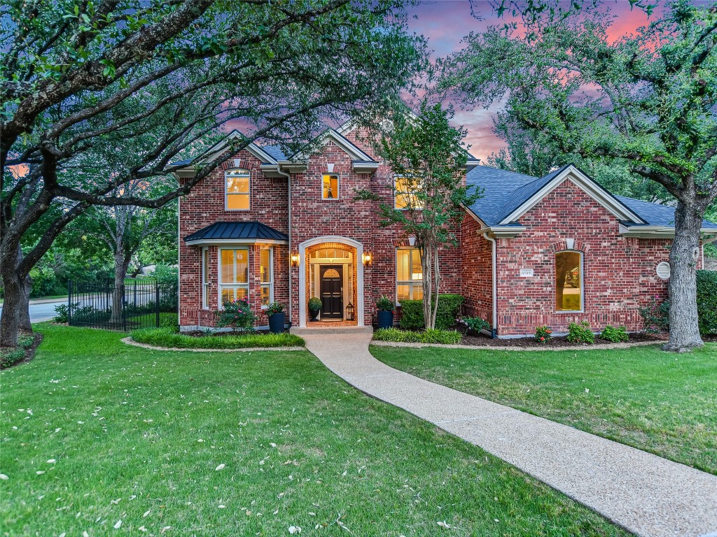 a front view of a house with a yard