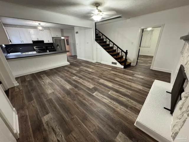 a view of living room with furniture and flat screen tv