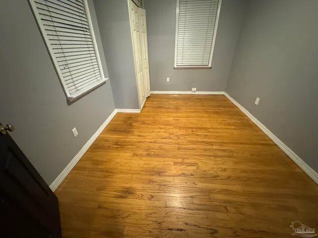 a view of bathroom with a sink and mirror