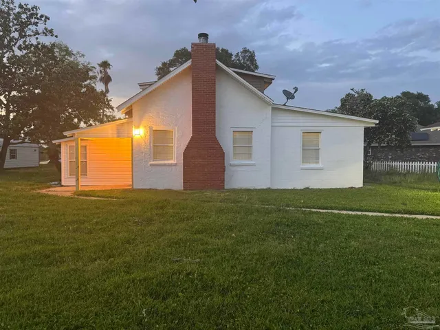 a backyard of a house with lots of green space