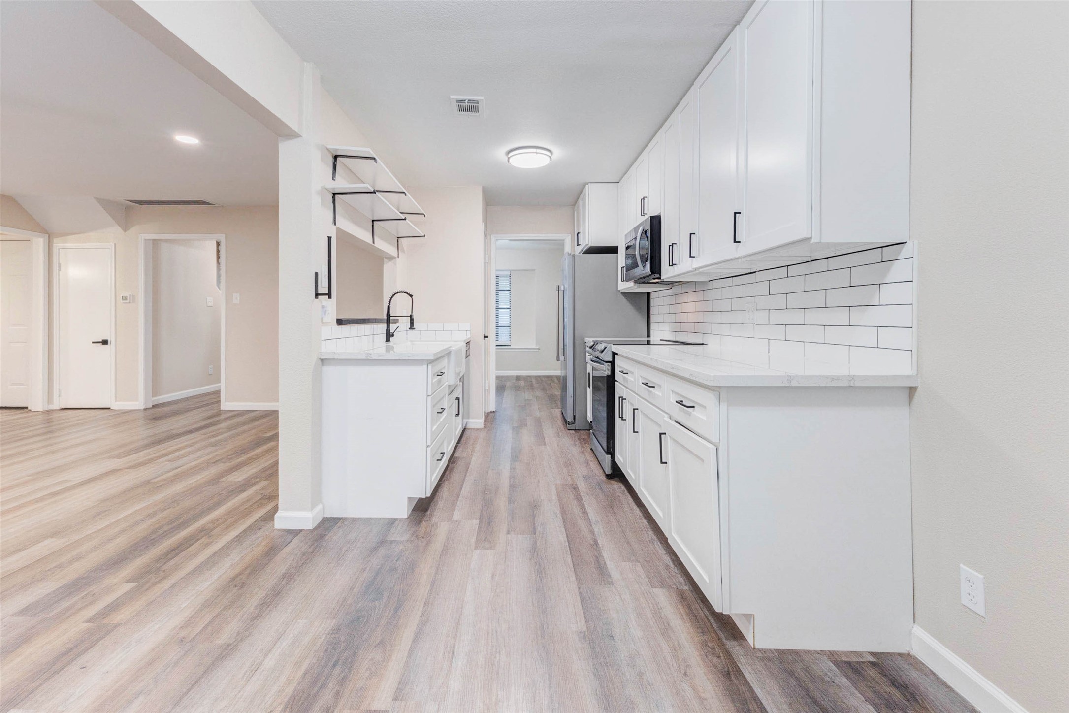 11222 Sagepark Lane Houston, TX 77089 - Photo 14 of 41 a large kitchen with a lot of counter space
