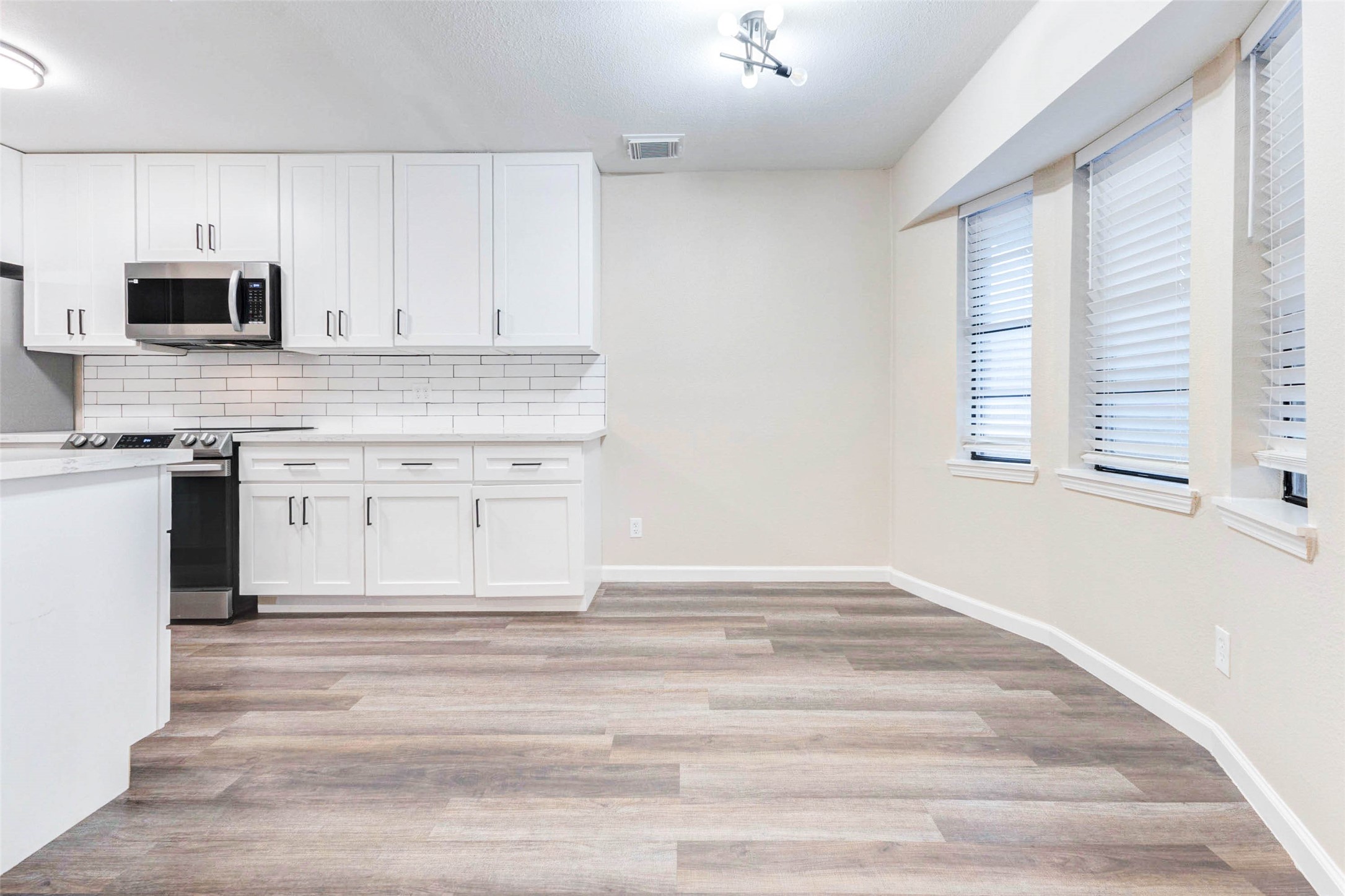 11222 Sagepark Lane Houston, TX 77089 - Photo 16 of 41 a kitchen with stainless steel appliances granite countertop a stove a sink and a microwave