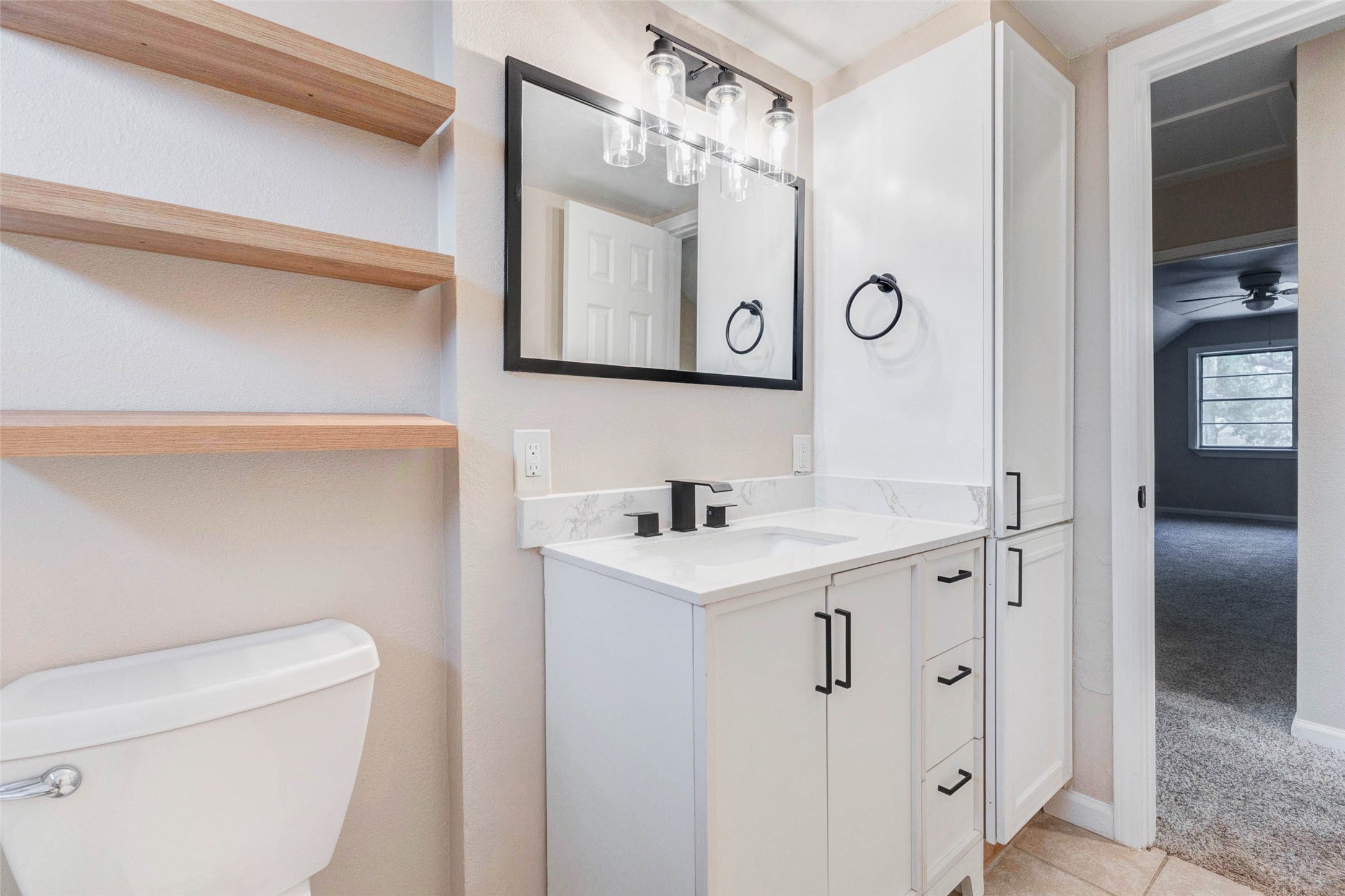 11222 Sagepark Lane Houston, TX 77089 - Photo 30 of 41 a bathroom with a sink a toilet and mirror