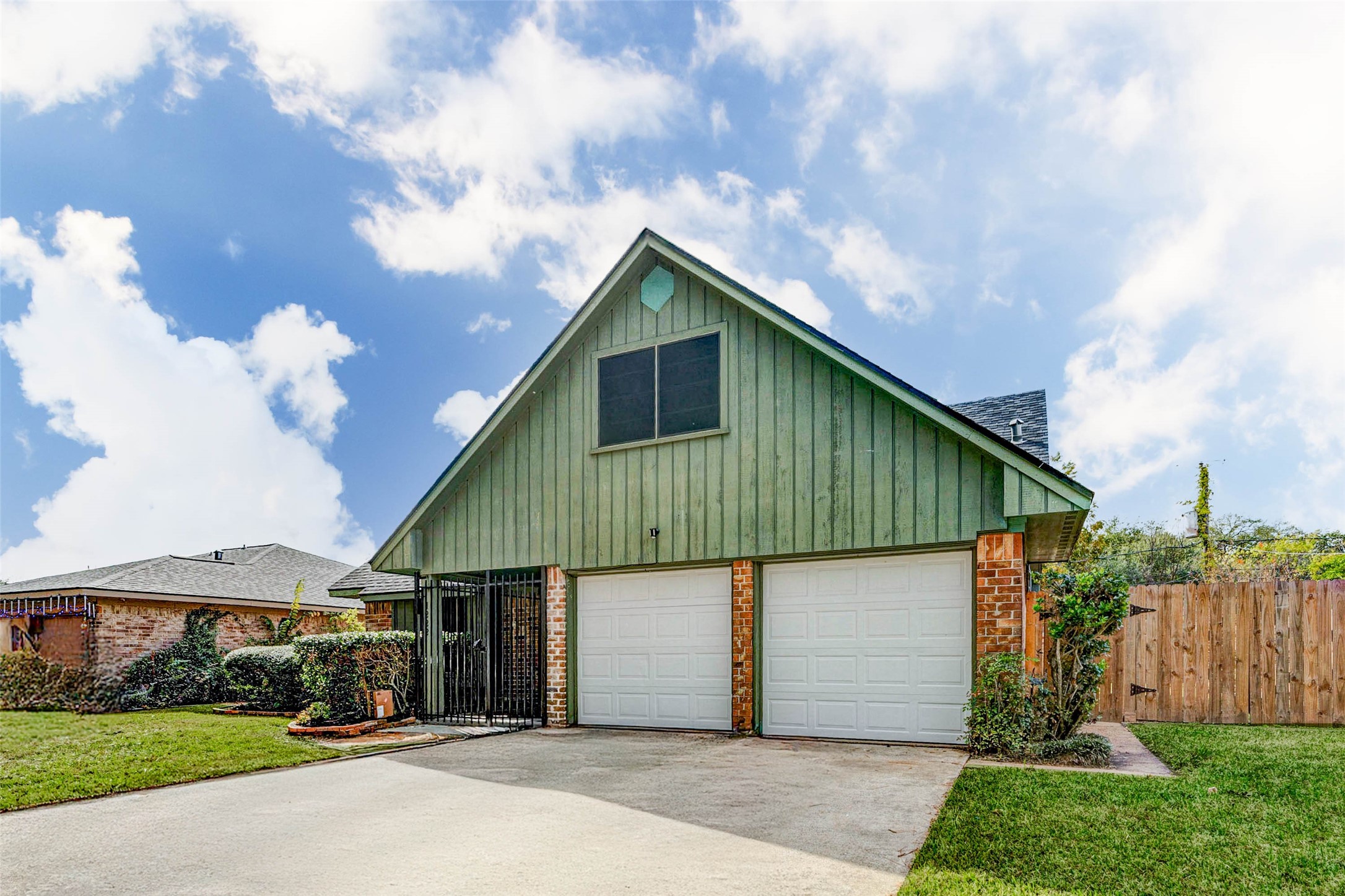 11222 Sagepark Lane Houston, TX 77089 - Photo 4 of 41 a front view of a house with a garden and trees