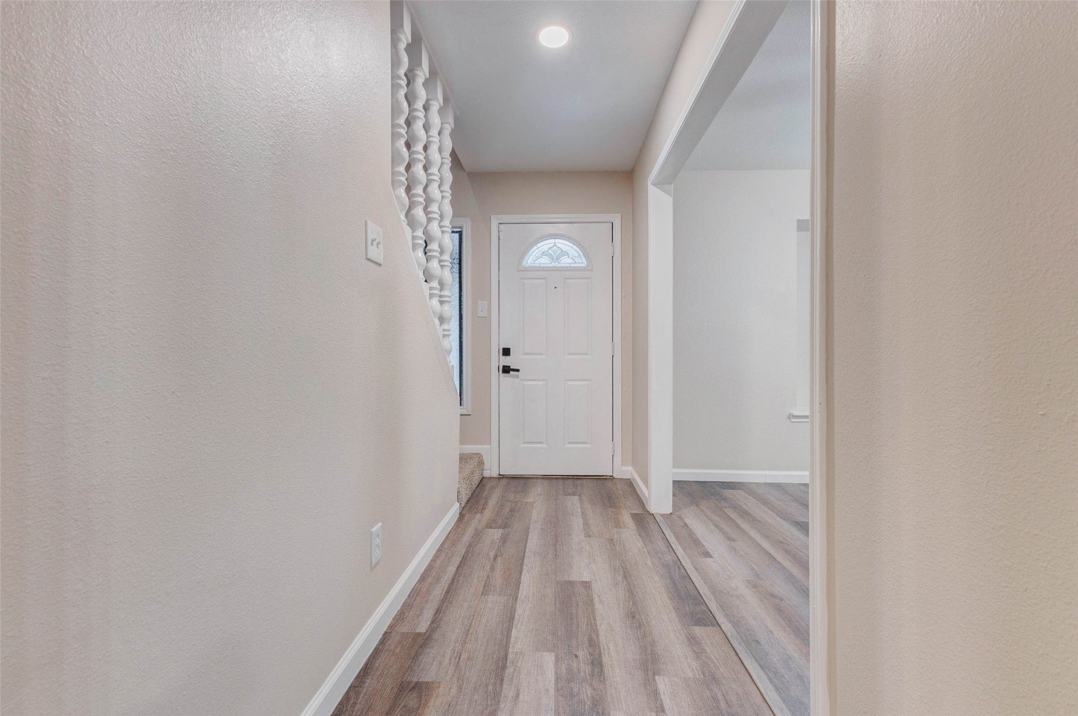 11222 Sagepark Lane Houston, TX 77089 - Photo 6 of 41 a view of a hallway with wooden floor