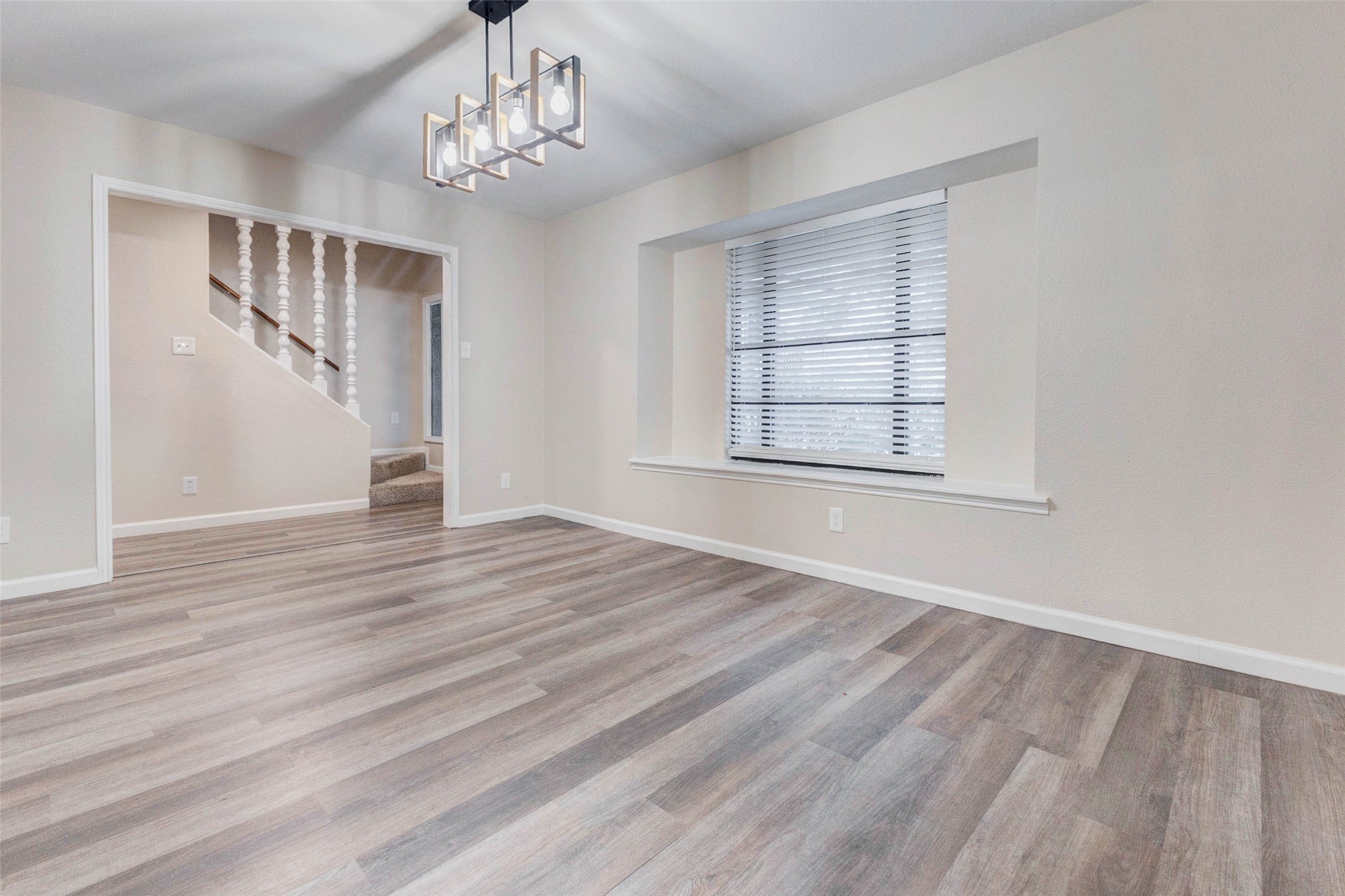 11222 Sagepark Lane Houston, TX 77089 - Photo 8 of 41 a view of empty room with wooden floor and fan