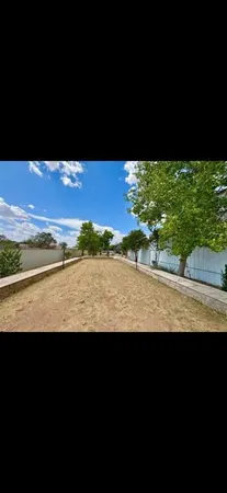 a view of house with backyard