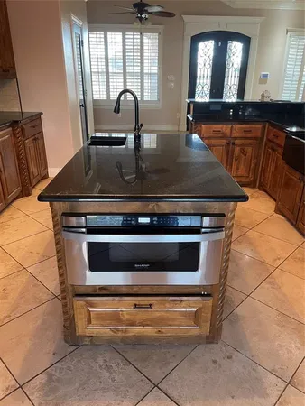 a close view of kitchen countertops and stove