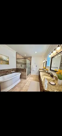 a view of a bathroom with sink and mirror