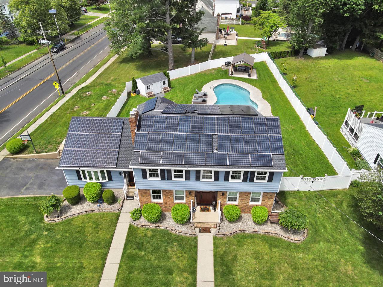 199 Applegate Drive Hamilton, NJ 08690 - Photo 1 of 40 a view of a swimming pool with a garden