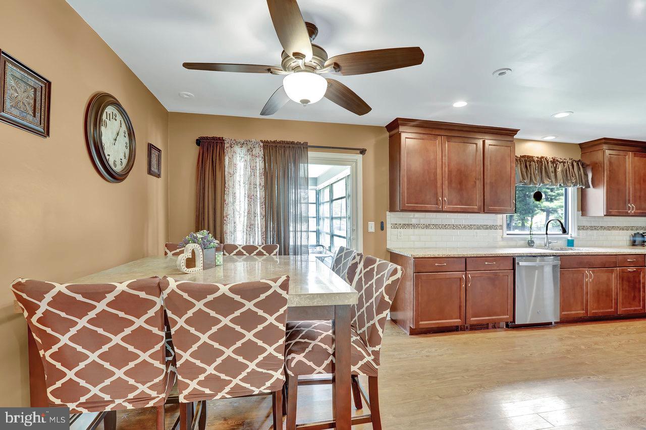 199 Applegate Drive Hamilton, NJ 08690 - Photo 14 of 40 a large white kitchen with a large window