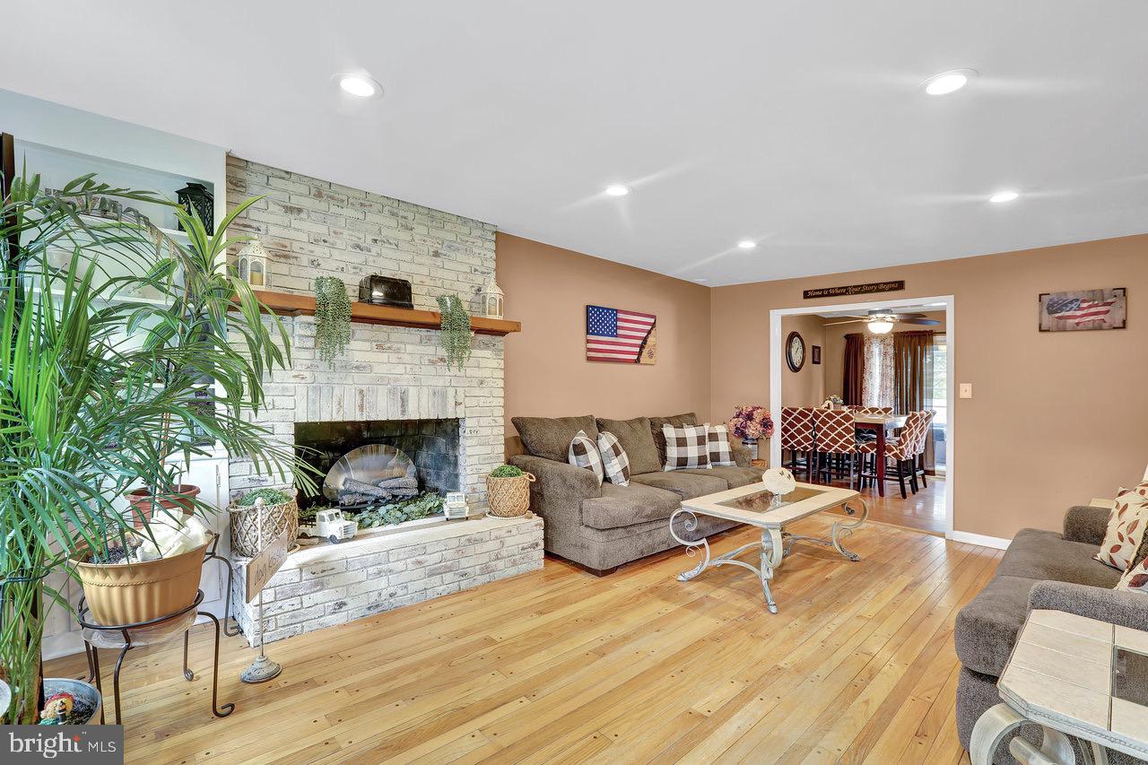 199 Applegate Drive Hamilton, NJ 08690 - Photo 16 of 40 a living room with furniture and a fireplace