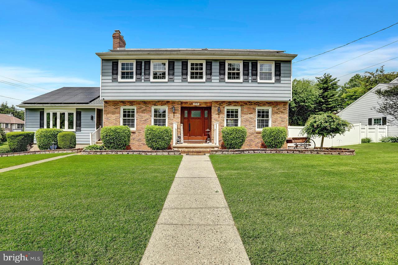 199 Applegate Drive Hamilton, NJ 08690 - Photo 2 of 40 a front view of house with yard and green space