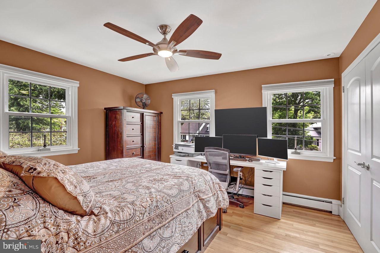 199 Applegate Drive Hamilton, NJ 08690 - Photo 25 of 40 a bedroom with a bed a window and a chandelier