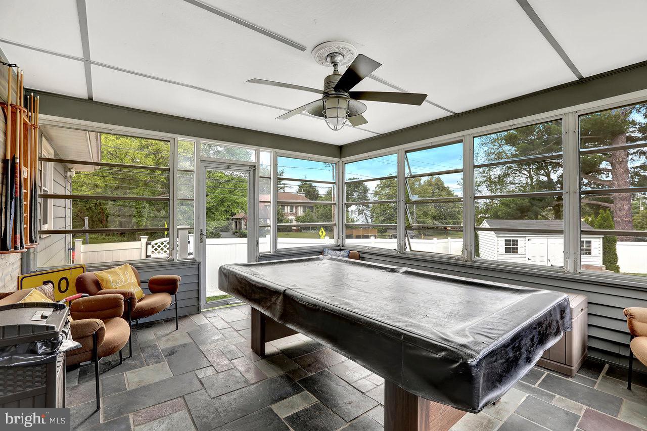 199 Applegate Drive Hamilton, NJ 08690 - Photo 32 of 40 a dining room with stainless steel appliances granite countertop a couch and a table