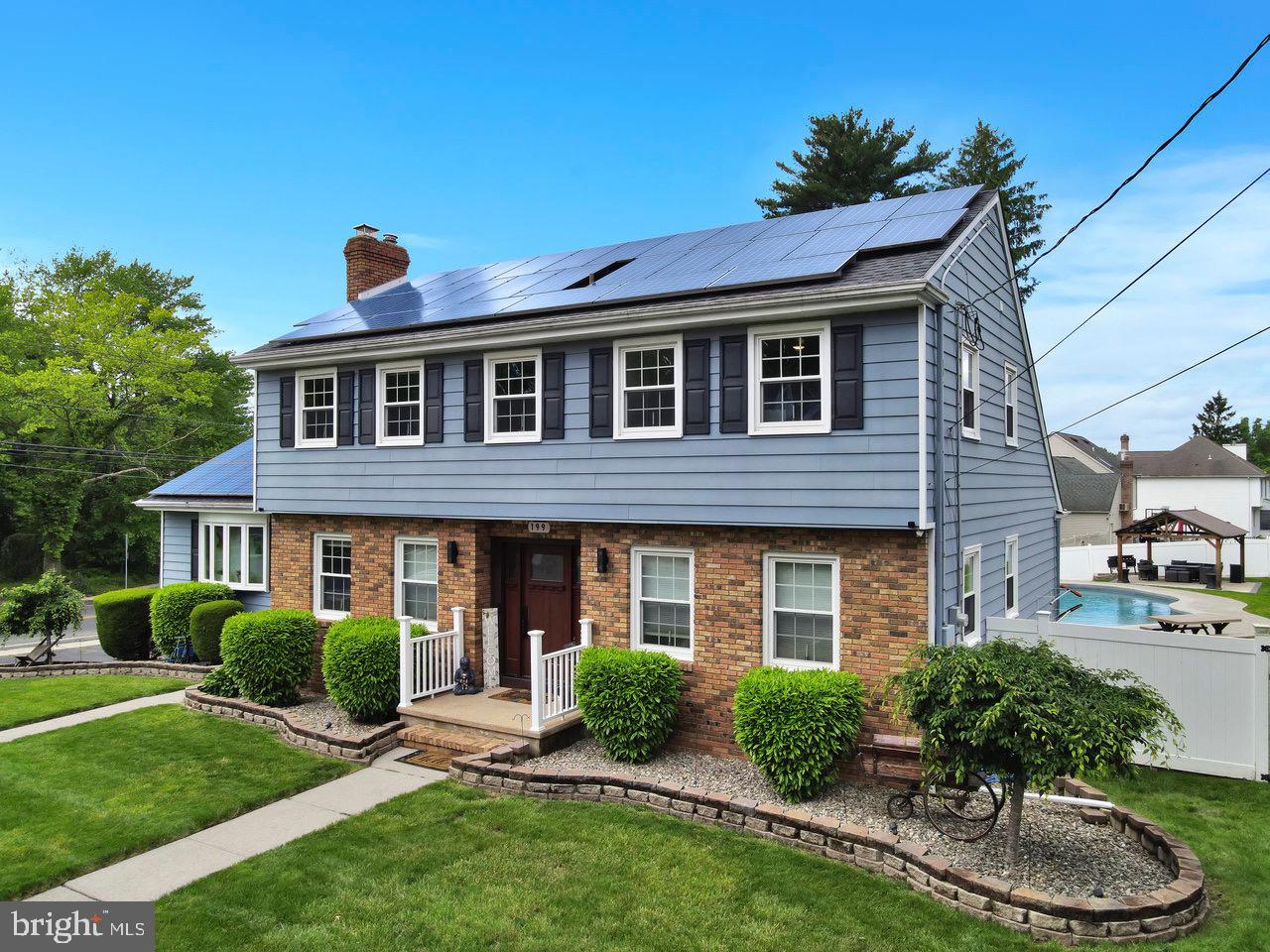 199 Applegate Drive Hamilton, NJ 08690 - Photo 38 of 40 a front view of a house with garden and porch