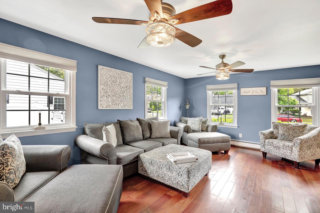 199 Applegate Drive Hamilton, NJ 08690 - Photo 7 of 40 a living room with furniture and a large window