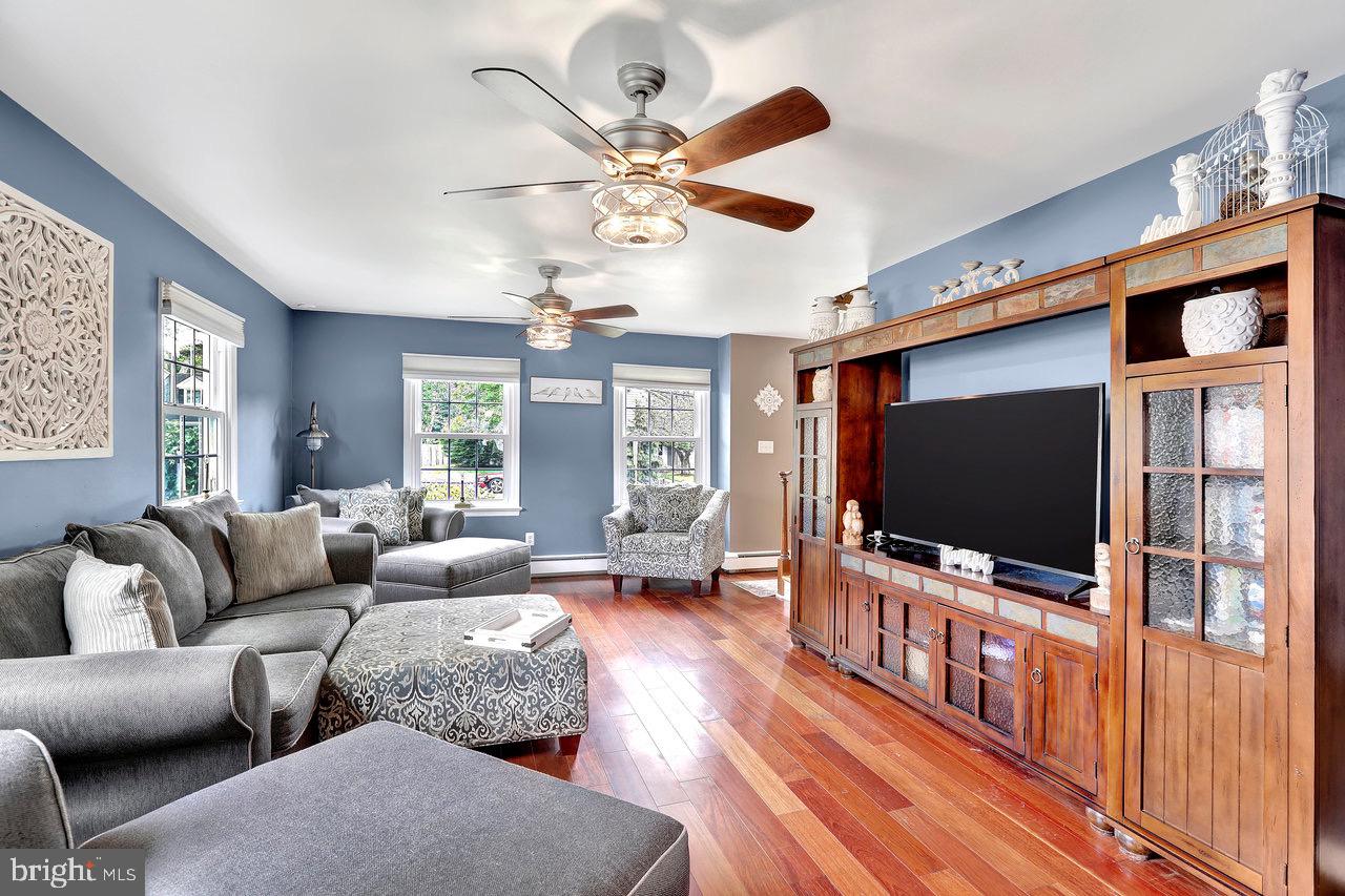 199 Applegate Drive Hamilton, NJ 08690 - Photo 8 of 40 a living room with furniture and a flat screen tv