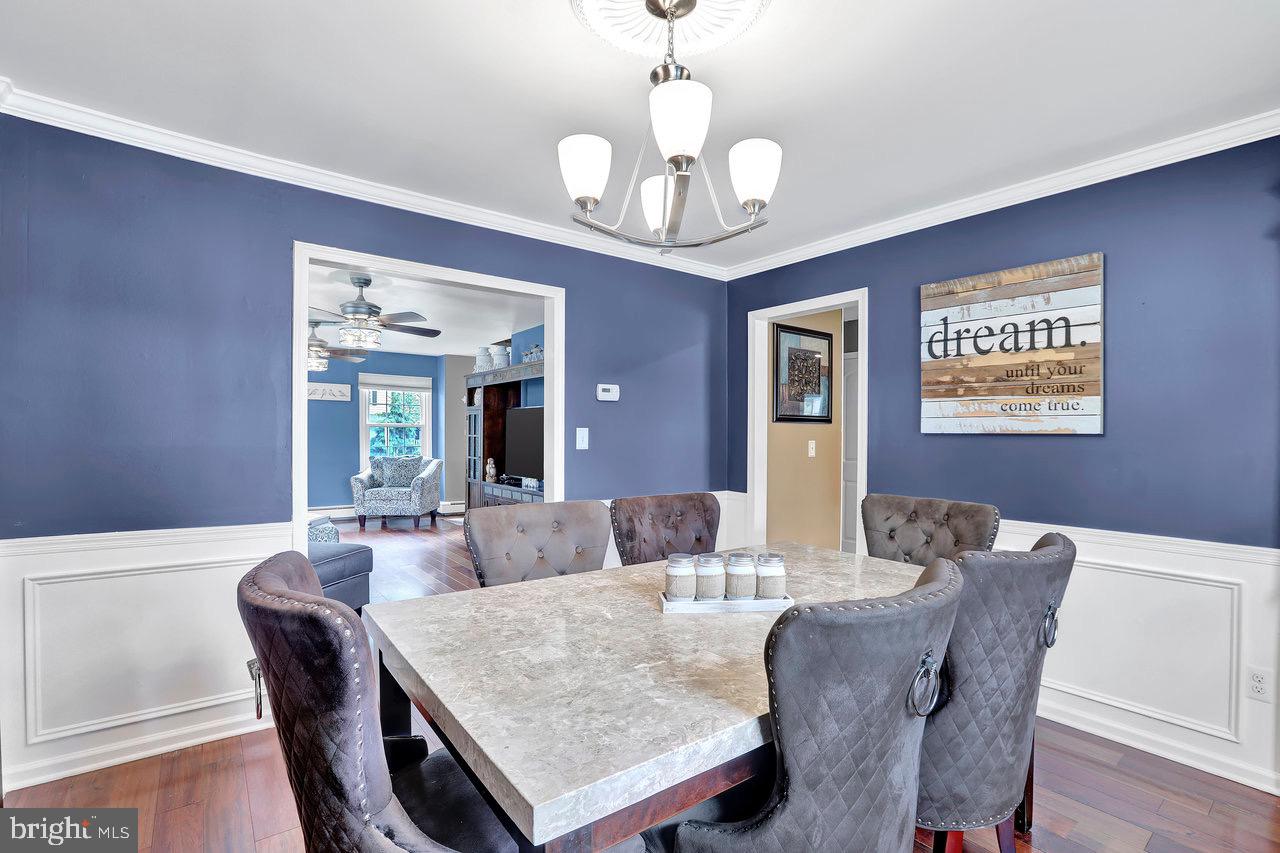 199 Applegate Drive Hamilton, NJ 08690 - Photo 10 of 40 a view of a dining room with furniture and wooden floor