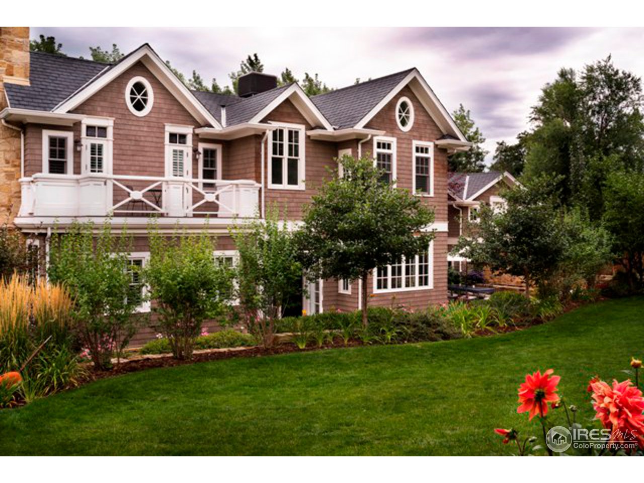 3189 5th Street Boulder, CO 80304 - Photo 1 of 25 a front view of a house with a garden
