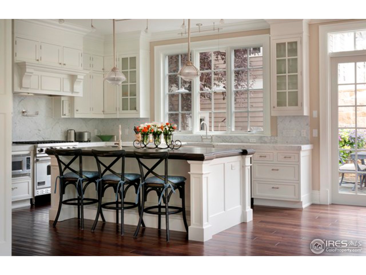 3189 5th Street Boulder, CO 80304 - Photo 12 of 25 a kitchen with a table chairs and cabinets