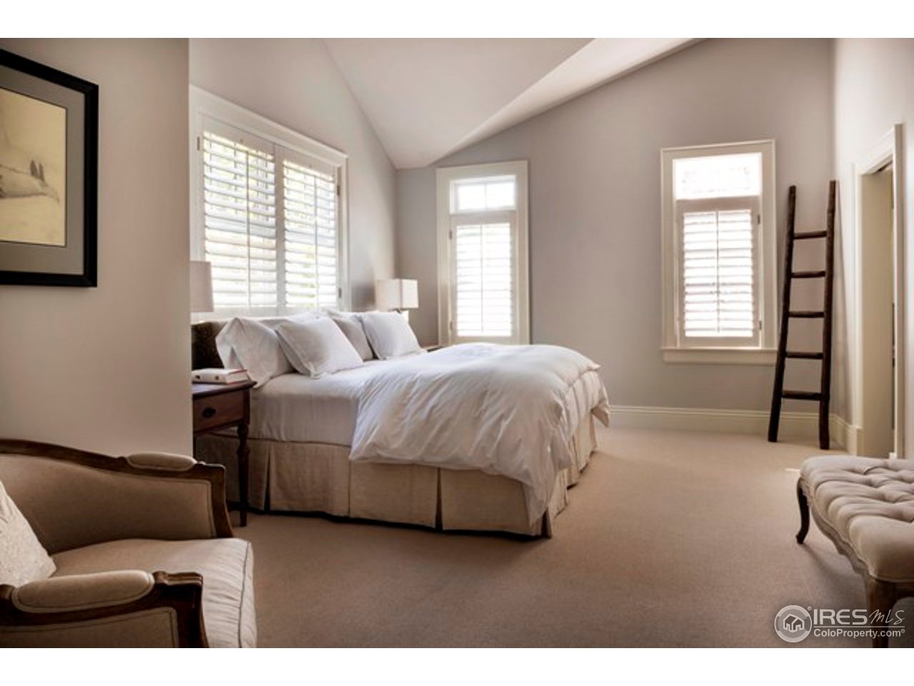 3189 5th Street Boulder, CO 80304 - Photo 20 of 25 a spacious bedroom with a bed and a couch
