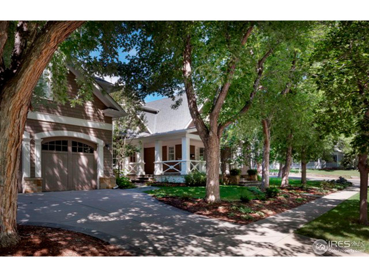 3189 5th Street Boulder, CO 80304 - Photo 2 of 25 a front view of a house with a yard