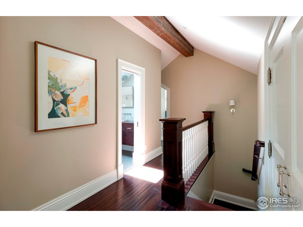 3189 5th Street Boulder, CO 80304 - Photo 24 of 25 a view of a hallway with wooden floor and stairs