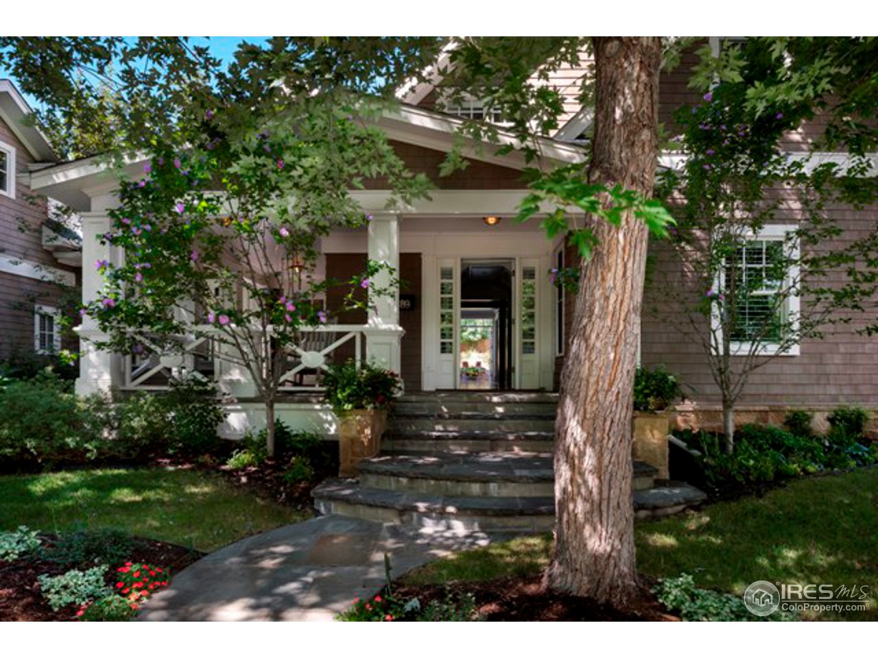 3189 5th Street Boulder, CO 80304 - Photo 3 of 25 a view of a house with a tree in front of it