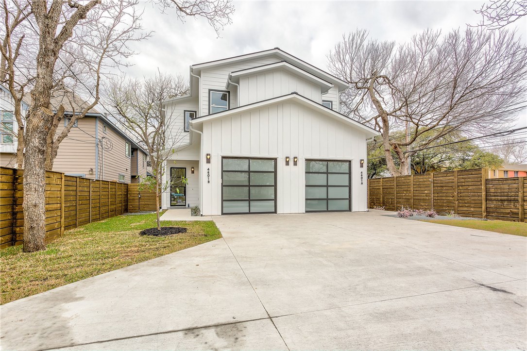 a view of a house with a outdoor space and a tree