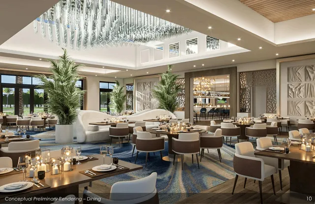 a living room with lots of furniture and view of kitchen