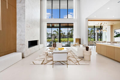 17119 Whitehaven Drive Boca Raton, FL 33496 - Photo 2 of 15 a living room with fireplace furniture and a floor to ceiling window
